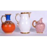 THREE ANTIQUE ENGLISH PORCELAIN JUGS, varying design. Largest 26 cm. (3)