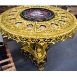 A LARGE ORMOLU MOUNTED CIRCULAR TABLE, inset with porcelain panels depicting Louis XVI and female