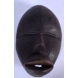 A WEST AFRICAN DAN MASK, formed with an exaggerated mouth. 22.5 cm x 15.5 cm.