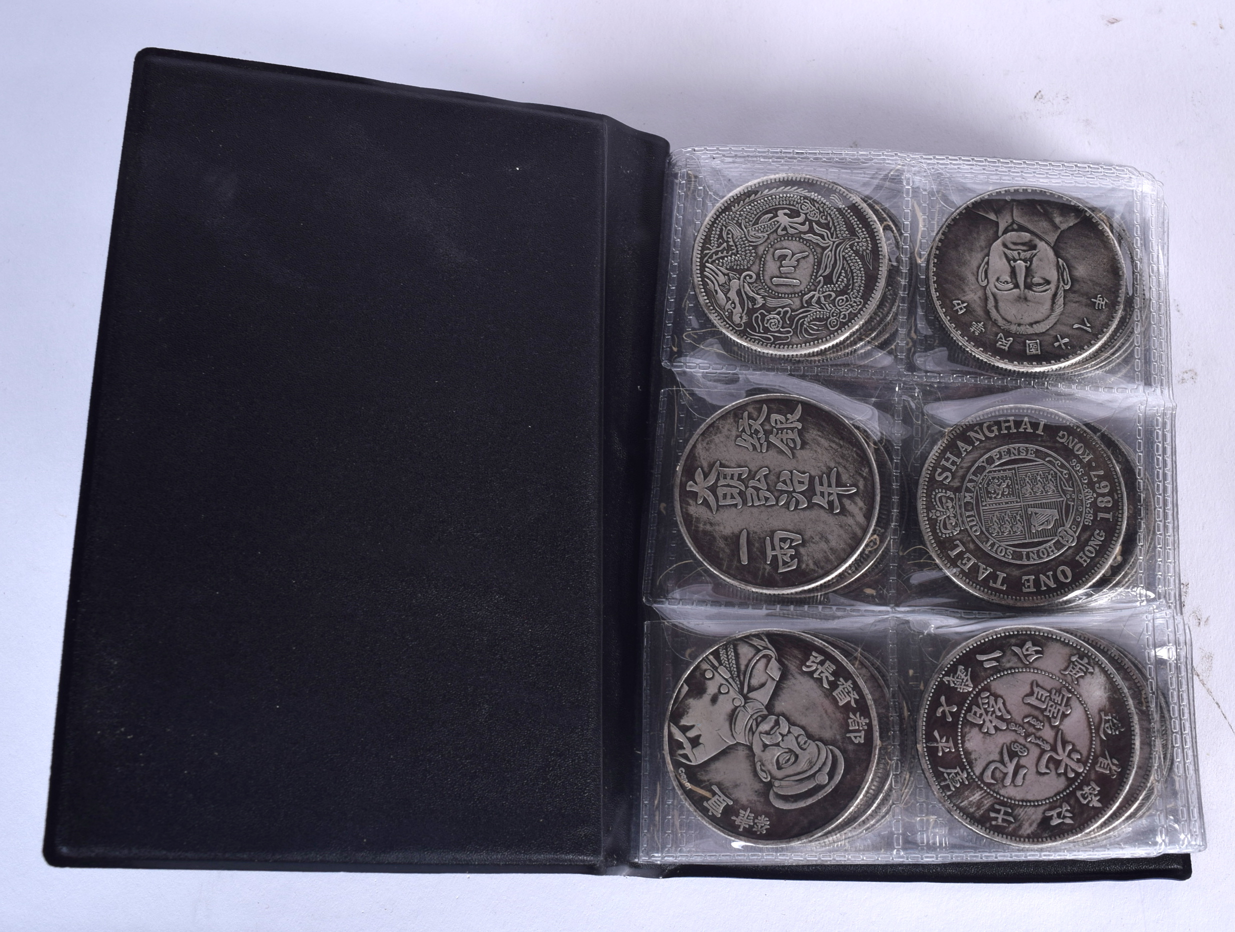 A COLLECTION OF CHINESE COINAGE, contained with a wallet. Wallet 15.5 cm x 9.5 cm.