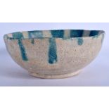 A 12TH/13TH CENTURY KASHAN POTTERY BOWL Persia, painted with drip glazed green motifs. 19 cm wide.