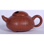 A CHINESE YIXING ZISHA POTTERY TEA POT, incised with calligraphy. 16 cm wide.