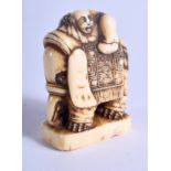 AN 18TH CENTURY JAPANESE EDO PERIOD CARVED IVORY SEAL formed as a figure seated upon an elephant. 2