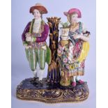 19th c. Minton figural taper stick group of a lady and gentleman standing on a blue and gilt base.
