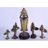 FIVE 18TH CENTURY INDIAN BRONZE BUDDHISTIC DEITY modelled holding bowls. Largest 21 cm high. (5)