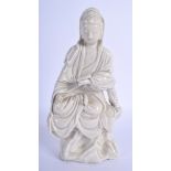 AN 18TH CENTURY CHINESE DEHUA FIGURE OF GUANYIN modelled holding a scroll. 24 cm x 9 cm.