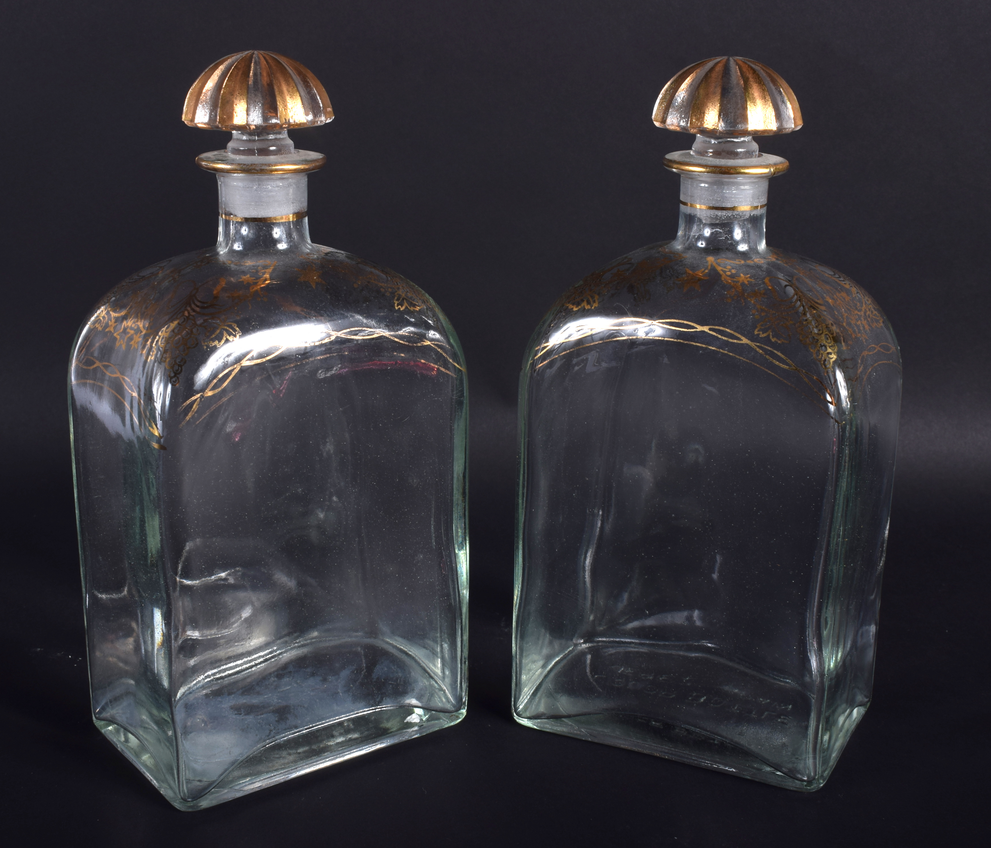 A PAIR OF 19TH CENTURY BOHEMIAN GILDED GLASS LIQUOR DECANTERS. 21 cm high. - Image 2 of 2