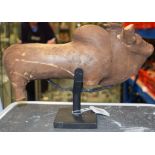A RARE INDUS VALLEY POTTERY VESSEL IN THE FORM OF A COW, upon a fitted stand. Cow 31 cm wide.