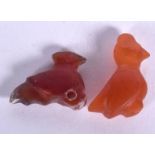 A CARVED MIDDLE EASTERN AGATE BIRD PENDANT, together with another bird carving. 2.25 CM LONG. (2)