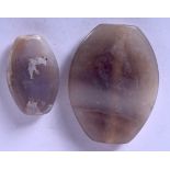 A LARGE BACTRIAN AGATE BEAD, together with another smaller example. Largest 6.5 cm x 4.75 cm. (2)