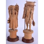 A PAIR OF EARLY 20TH CENTURY BAVARIAN BLACK FOREST FIGURES modelled in roaming stances. 17 cm high.