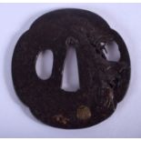 A 19TH CENTURY JAPANESE MEIJI PERIOD GOLD INLAID IRON TSUBA decorated with a bullock within a lands