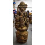 A LARGE NIGERIAN YORUBA WOODEN STATUE, formed as a bearded male on horseback surrounded by attendan