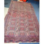 A 19TH CENTURY TEKKE TURKMEN RED GROUND RUG, decorated with geometric design. 250 cm x 150 cm.