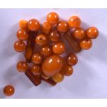 A QUANTITY OF AMBER BEADS, varying form. (qty)