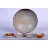 A CHINESE SUNG DYNASTY PALE GLAZED BOWL, together with four tea bowls. Largest 15.5 cm wide. (5)