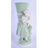 19th c. Minton celadon figure of a girl holding a large wicker basket on her back. 22cm high