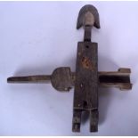 A MALIAN DOGON WOODEN GRANARY DOOR LOCK, figural in form. 45.5 cm x 41 cm.