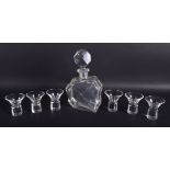 A STYLISH 1950S CZECH BOHEMIAN CLEAR GLASS DECANTER with six matching glasses. Decanter 24 cm high.