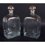 A PAIR OF 19TH CENTURY BOHEMIAN GILDED GLASS LIQUOR DECANTERS. 21 cm high.