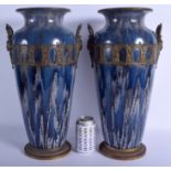 A LARGE PAIR OF ANTIQUE CONTINENTAL POTTERY VASES mounted in classical brass. 46 cm high.