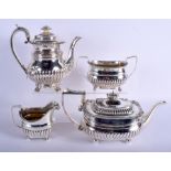 AN EARLY 19TH CENTURY ENGLISH FOUR PIECE SILVER COFFEE SET. London 1824. 68 oz. Largest 21 cm x 18