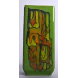 A STYLISH LIME GREEN POOLE POTTERY VASE, formed with textured floral panels and drip decoration. 20