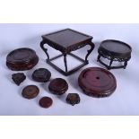 A COLLECTION OF 19TH/20TH CENTURY CHINESE AND JAPANESE STANDS in various forms and sizes. (qty)