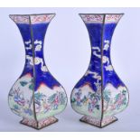 A PAIR OF 19TH CENTURY CHINESE CANTON ENAMEL VASES Late Qing, painted with figures. 21 cm high.