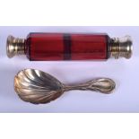A VICTORIAN SILVER CADDY SPOON and a ruby double ended scent bottle. (2)