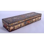 A LARGE 19TH CENTURY PERSIAN INDIAN QAJAR LACQUERED RECTANGULAR BOX decorated with foliage and vine