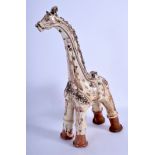 A TURKISH CANAKKALE POTTERY GIRAFFE painted with motifs. 36 cm high.