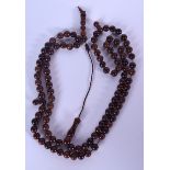 A CHINESE NECKLACE, formed with spherical beads. 80 cm long.