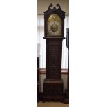 A 19TH CENTURY JACOBEAN REVIVAL LONGCASE CLOCK with brass dial and silvered chapter ring. 220 cm x