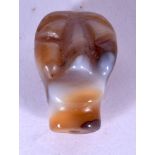 A YEMENI CARVED AGATE BEAD, formed as the head of ana animal. 2.4 cm long.