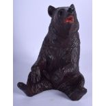 A 1920S BAVARIAN BLACK FOREST CARD SEATED BEAR possibly a tobacco jar. 22 cm x 12 cm.