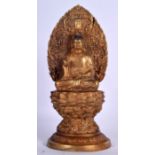 A CHINESE GILT BRONZE BUDDHA, formed upon a flaming shrine with one hand raised. 38 cm high.