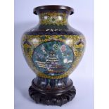 A LARGE EARLY 20TH CENTURY CHINESE CLOISONNE ENAMEL VASE decorated with birds and butterflies. Vase