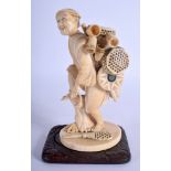 A 19TH CENTURY JAPANESE MEIJI PERIOD CARVED IVORY OKIMONO modelled as a male carrying baskets. Ivor