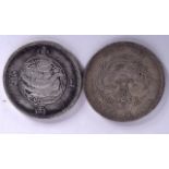 TWO CHINESE WHITE METAL COINS, “One Tael Shanghai”, with another similar. 3.75 cm wide. (2)