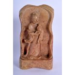 A 19TH CENTURY CHINESE CARVED SOAPSTONE FIGURE OF A BUDDHIST DEITY modelled holding an urn. 18 cm x