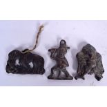 THREE TIBETAN BRONZE PLAQUES, varying design Largest 6 cm wide. (3)