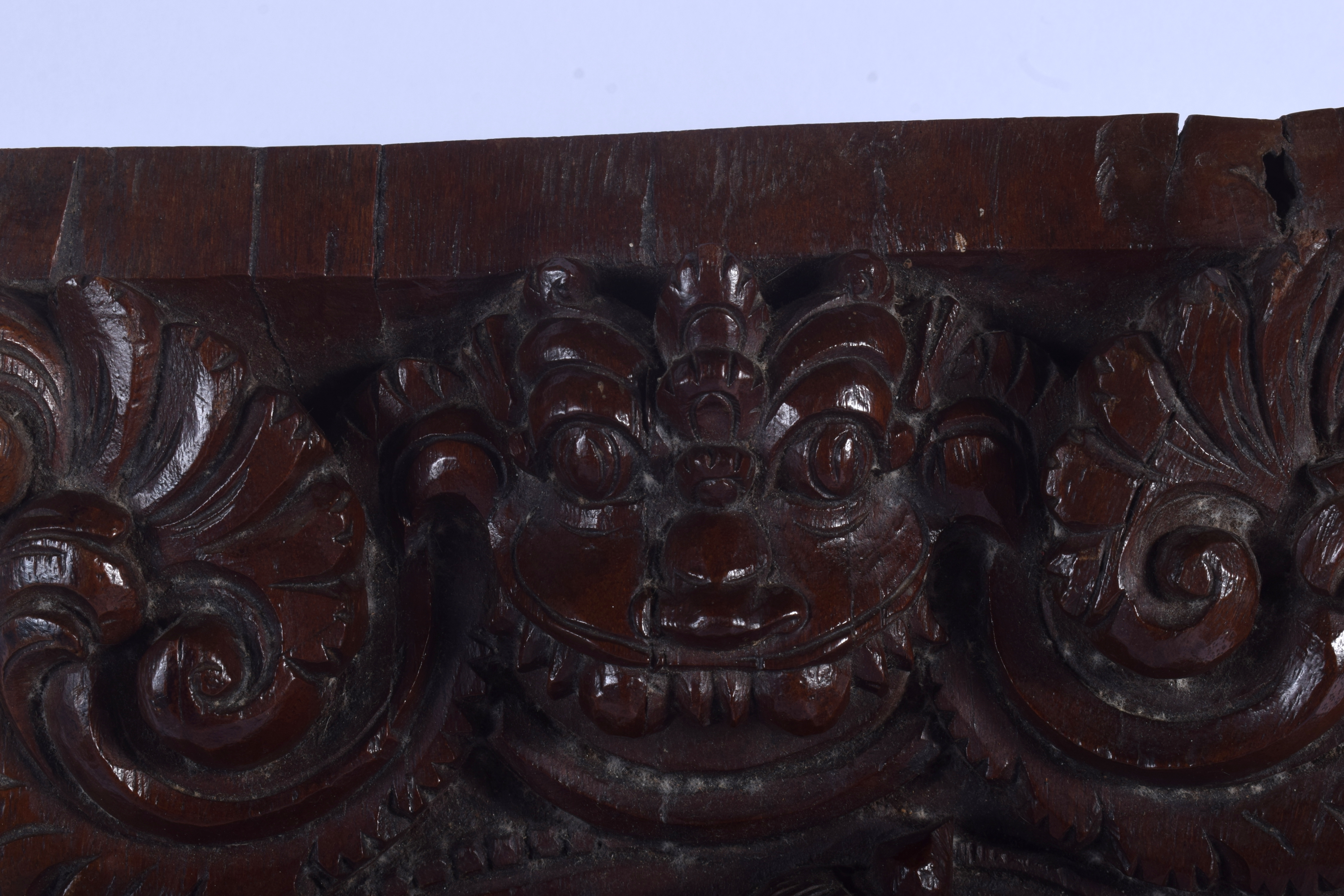 A LOVELY 19TH CENTURY INDIAN CARVED HARDWOOD BUDDHISTIC PANEL depicting deity holding aloft figures - Bild 4 aus 5