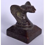 A CHINESE BRONZE SEAL, the terminal in the form of a cobra head. 4.25 cm high.