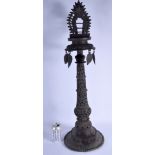 A LARGE 19TH CENTURY INDIAN BRONZE BUDDHISTIC OIL LAMP with openwork cylindrical column. 84 cm x 18