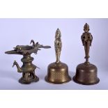 TWO 19TH CENTURY INDIAN BRASS BUDDHISTIC BELLS together with another similar figure. 20 cm & 14 cm