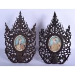 A PAIR OF 19TH CENTURY INDIAN PAINTED IVORY PORTRAIT MINIATURES formed within hardwood frames. Ivor