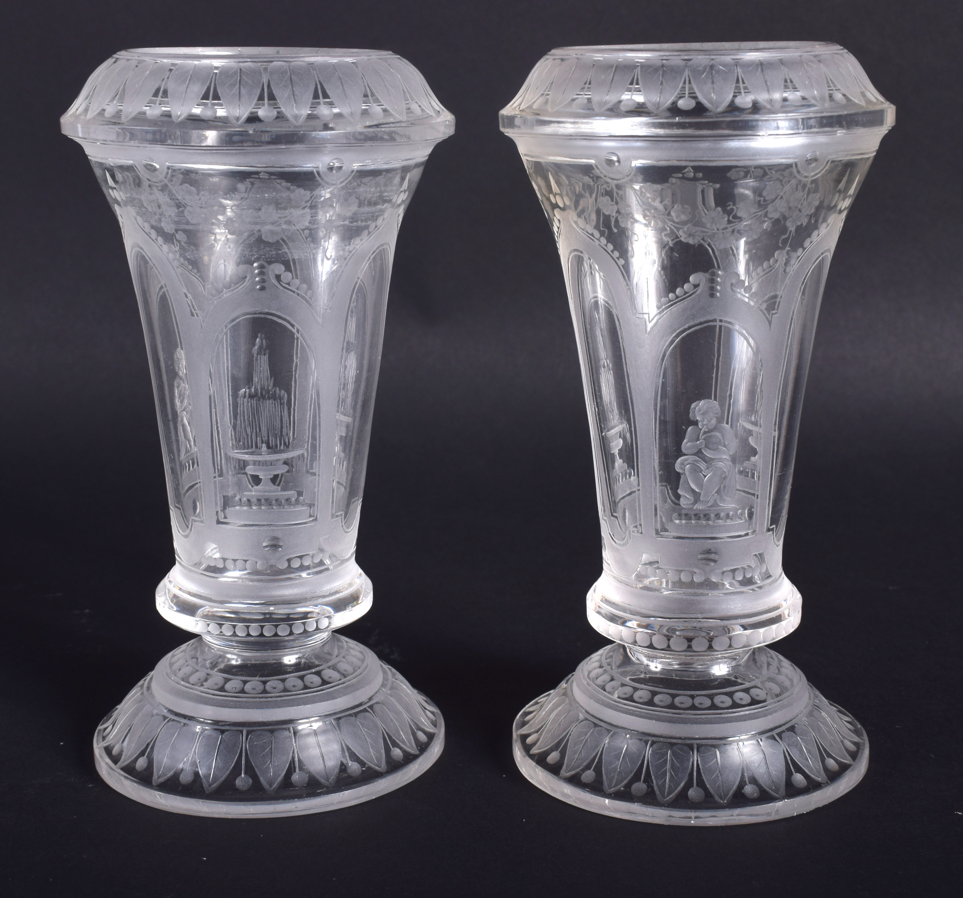 A PAIR OF 19TH CENTURY VENETIAN CLEAR GLASSES etched with figures and buildings. 12.5 cm high. - Image 2 of 3