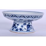 A CHINESE BLUE AND WHITE PORCELAIN STEM DISH BEARING XUANDE MARKS, painted with the phoenix bird in