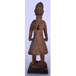 A LARGE WEST AFRICAN POLYCHROMED WOODEN STATURE, in the form of a standing female. 50 cm high.